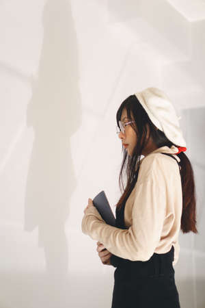 Charming Asian girl in casual wear at universityの写真素材