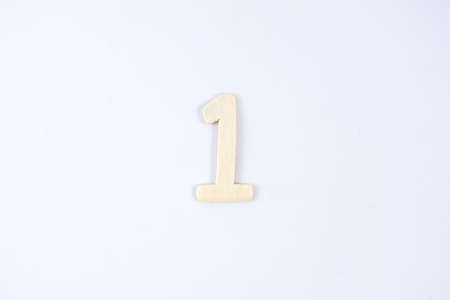 Wooden number one  on white backgroundの写真素材