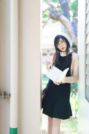 Charming Asian girl in casual wear at universityの写真素材