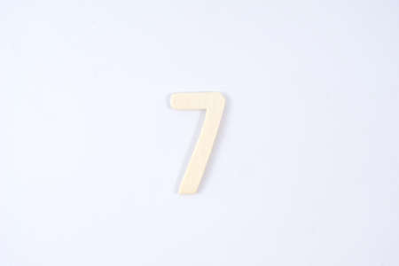 Wooden number seven on white backgroundの写真素材