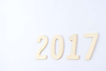 Happy New Year 2017 of real wooden letters for isolated on white backgroundの写真素材