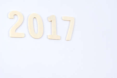 Happy New Year 2017 of real wooden letters for isolated on white backgroundの写真素材