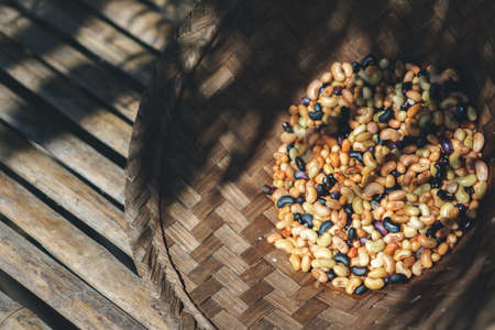Mixed beans were washed in straw containerの写真素材