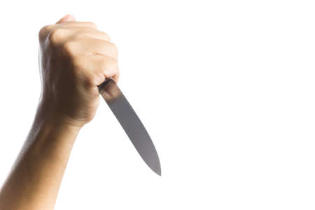 A hand holding knife on white backgroundの写真素材
