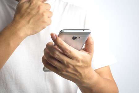 A man using mobile phone on white backgroundの写真素材