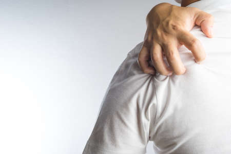 Man scratch the itch with handの写真素材