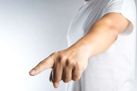 index finger pointing on white backgroundの写真素材