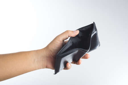 Hand holding empty old wallet on white backgroundの写真素材