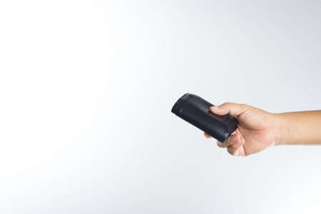 Hand holding old wallet on white backgroundの写真素材