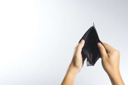 Hand holding empty old wallet on white backgroundの写真素材