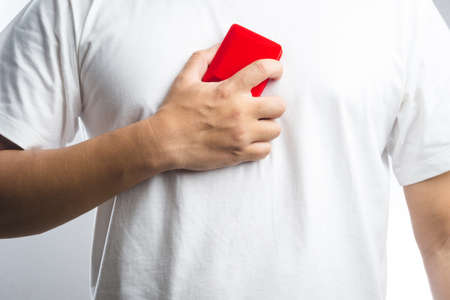 A man Hand holding a Red velvet box on white background