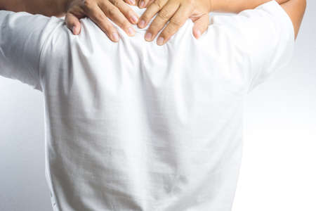 A man with back pain on white background