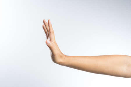 hand with stop gesture on white backgroundの写真素材