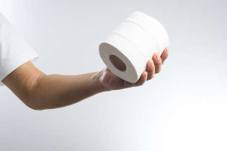 Hand with tissue paper on white background