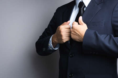 Business man dressing up on white backgroundの写真素材
