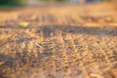 Dirt road in Asian country with wheel trackの写真素材