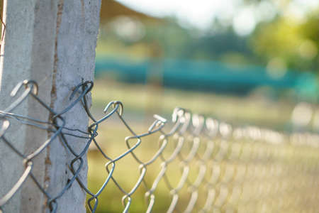 Wire steel fence in animal farm of Asian countryの写真素材