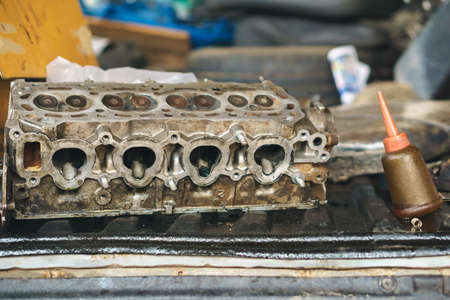 Opened old engine block interior part of car for repairingの写真素材