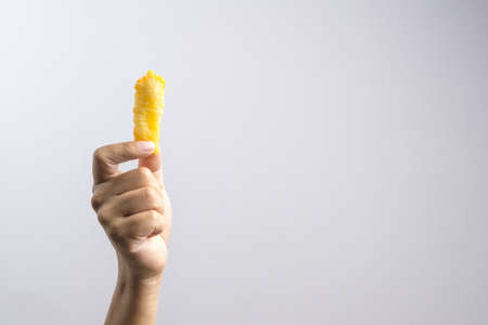 Homemade fried potatoes with cheese powder on white background
