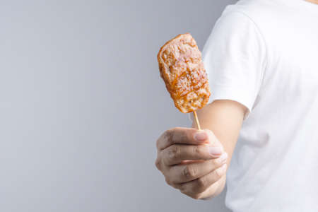 Grilled pork with sweet spicy sauce on Skewer as famous Thai traditional foodの写真素材