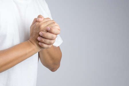 Hand with praying sign or gesture in christian religion on white backgroundの写真素材