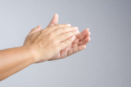 Clapping hand sign on white backgroundの写真素材