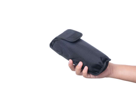 Hand holding speedlight flash pouch bag, a camera equipment on white backgroundの写真素材