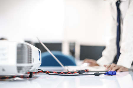 A multimedia presentation in a meeting or classroom by connect computer with projectorの写真素材