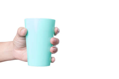 Hand holding plastic cup of water on white backgroundの写真素材