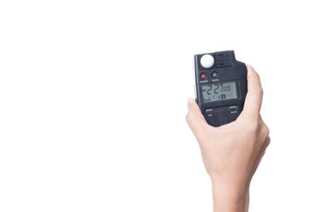 Hand holding light exposure meter, a photograph device for measuring illumination on white...