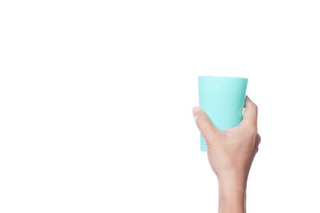 Hand holding plastic cup of water on white backgroundの写真素材