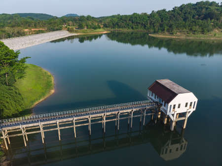 Water treatment plant, pumping station next to of big reservoir inside public university of Thailandの写真素材
