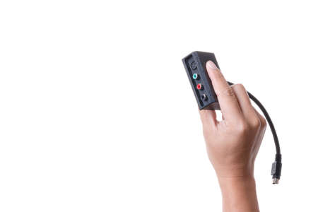 Hand holding s video convert from media player or computer to component plug cable on white...