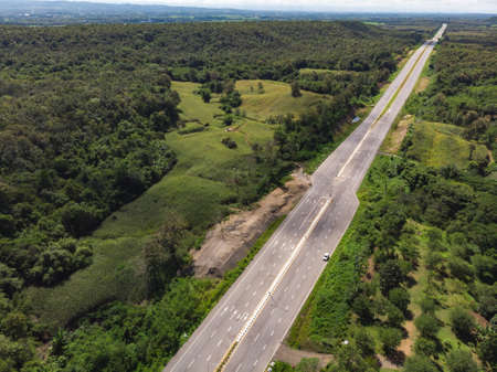 Asphalt road through mountain and forest in Asian countryのeditorial素材