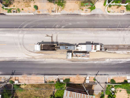 Asphalt grinding machine operator job at replacement construction road siteの写真素材