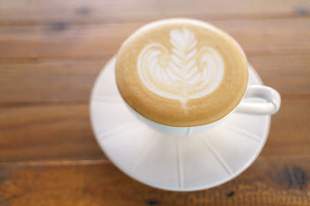 Cup of coffee with latte art pattern milk foamの写真素材