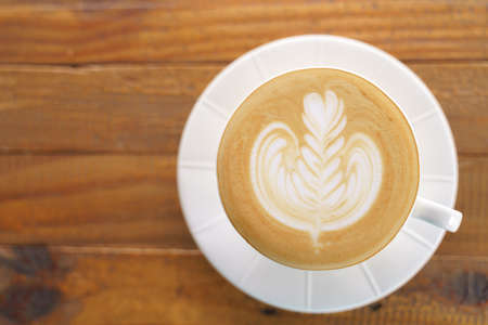 Cup of coffee with latte art pattern milk foamの写真素材