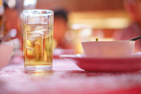 Drinking Thai whiskey mixed with soda water and ice in ceremony or event in Thailandの写真素材