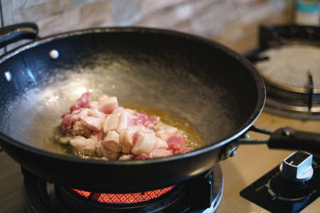 Deep fried crispy pork with skin cooking process with pan