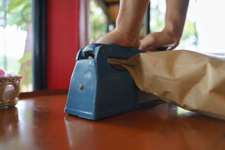 Manual impulse heat sealer for sealing paper bag productの写真素材