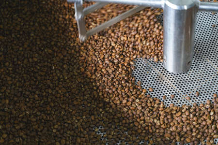 Coffee roasting machine process by spinning roasted beansの写真素材
