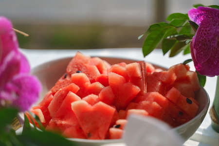 sliced watermelon in bowl af buffet cafeの写真素材