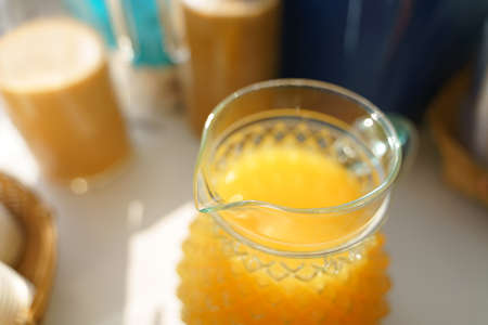 Glass mug full of orange juiceの写真素材