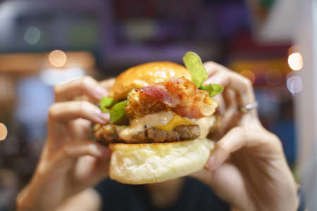 Fried pork burger with blurred backgroundの写真素材