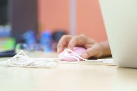 Hand using computer wired mouseの写真素材