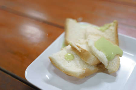 Thai steamed custard bread with sweet milk dip