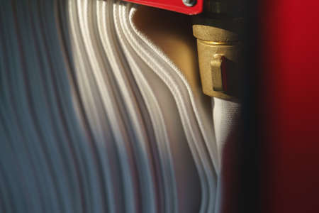 Brass fire hose reel in the cabinet