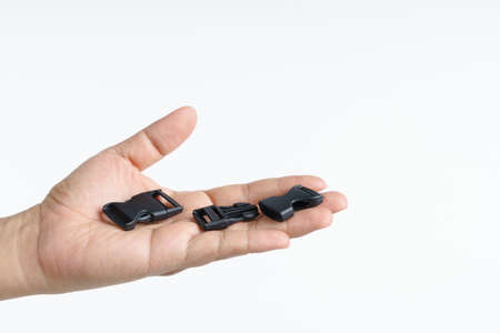Hand holding plastic clip lock strap on white backgroundの写真素材