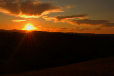 sunrise over the mountains, meadows, ridges Romanianの写真素材