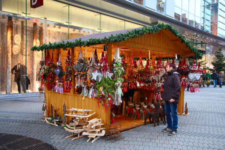 NUREMBERG, GERMANY - DECEMBER 21, 2013: A souvenir stall at the Christmas fair on Karolinenstrasse, Nuremberg, Germanyのeditorial素材
